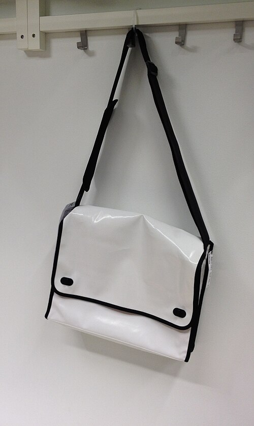 a white container with a shoulder strap
